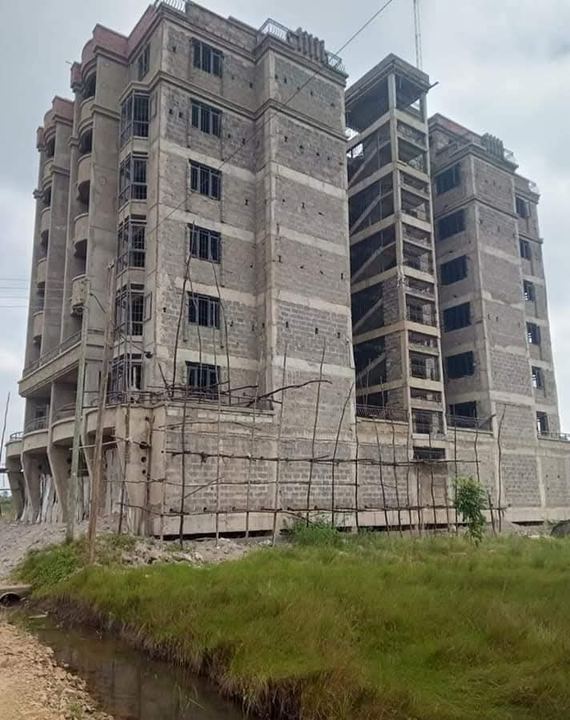 Multi-storey apartment block under construction with scaffolding