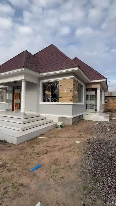 Compact bungalow with a maroon roof